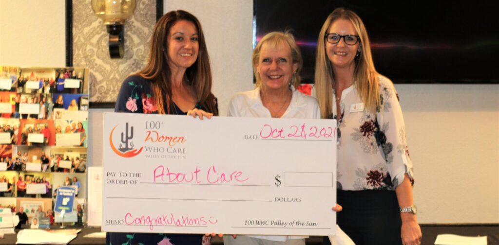 Ann Marie accepting 100+ Women Who Care, Valley of the Sun, donation